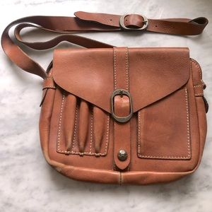 Light brown leather crossbody adjustable buckle strap/magnetic button closure